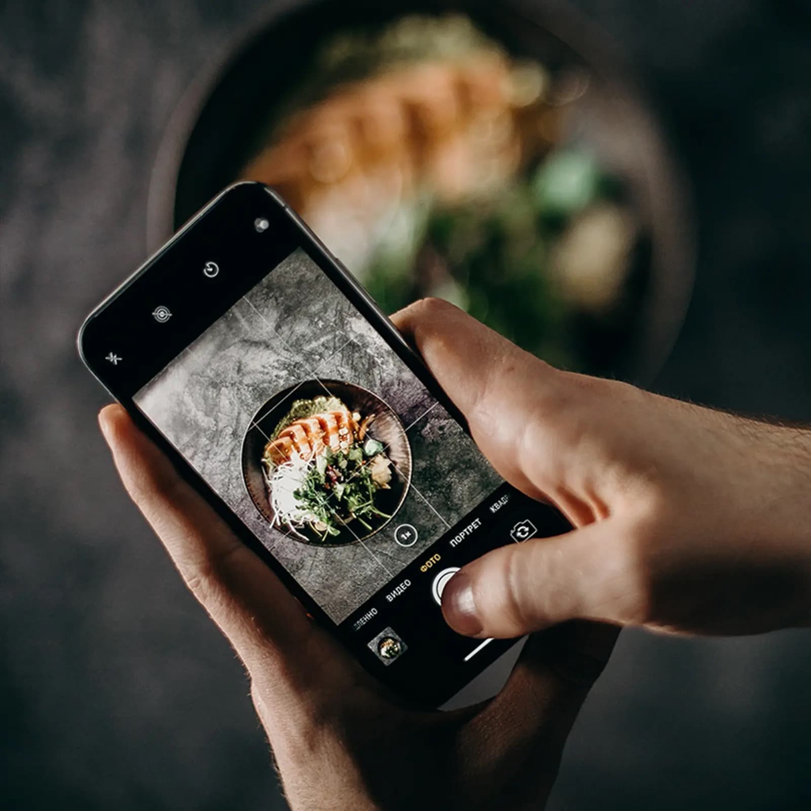 Guest photographing a plated dish